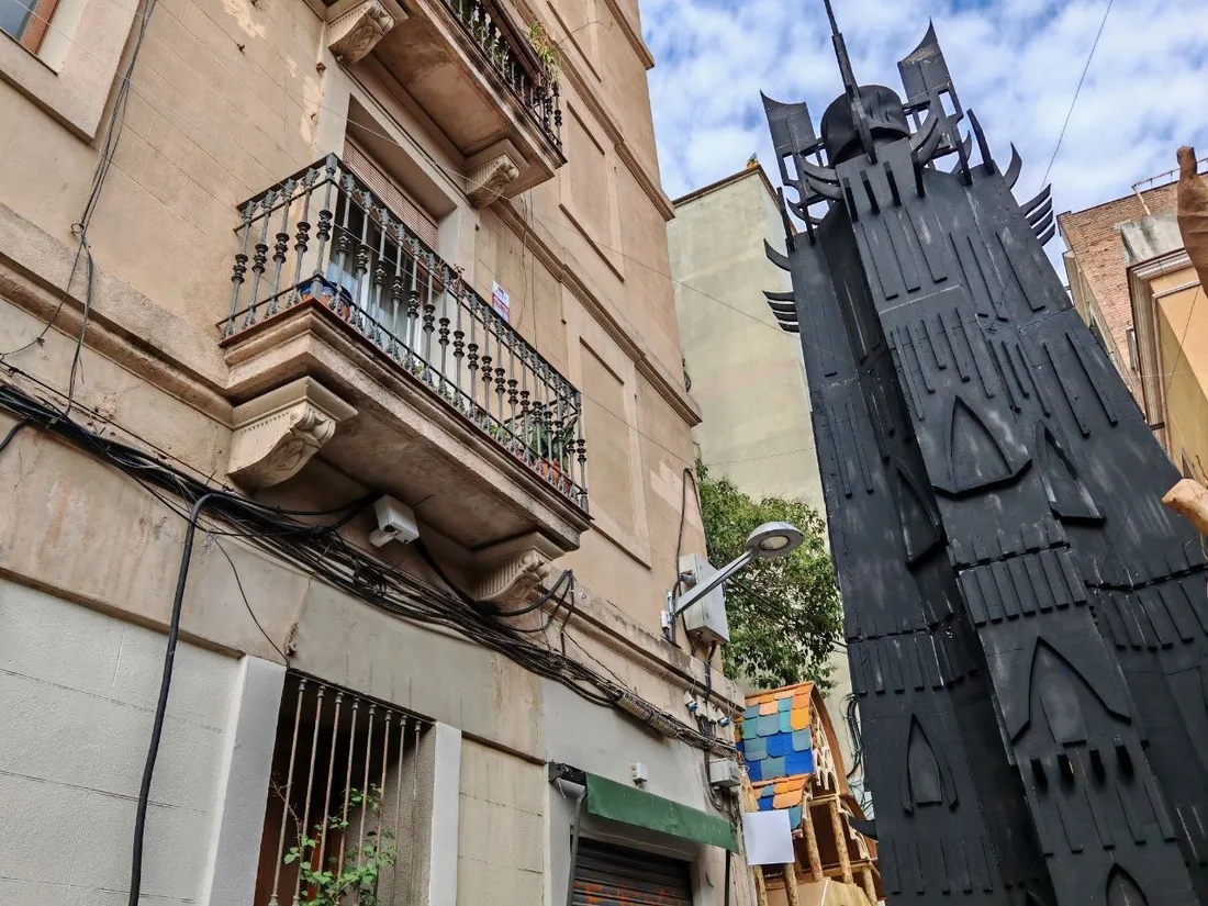 Black tower of the Festa Major decorations on Carrer Fraternitat de Baix